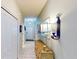 Bright hallway with tile floors and decorative console table at 1582 Moon Valley Dr, Champions Gate, FL 33896