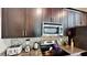 Modern kitchen features granite countertops and stainless steel appliances at 1582 Moon Valley Dr, Champions Gate, FL 33896