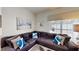 Living room features sectional sofa and large windows at 1582 Moon Valley Dr, Champions Gate, FL 33896