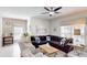 Spacious living room with comfortable seating and large windows at 1582 Moon Valley Dr, Champions Gate, FL 33896