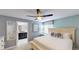 Large bedroom with a king-size bed, ensuite bathroom, and ceiling fan at 1582 Moon Valley Dr, Champions Gate, FL 33896