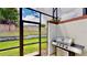 Screened patio with grill and access to backyard at 1582 Moon Valley Dr, Champions Gate, FL 33896