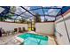 Private screened-in pool with patio furniture at 1582 Moon Valley Dr, Champions Gate, FL 33896