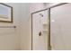Shower with glass enclosure and tile surround at 1582 Moon Valley Dr, Champions Gate, FL 33896