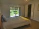 Main bedroom with sliding doors leading to the backyard at 1902 Abbington St # 1902, Apopka, FL 32712