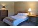 Bedroom with a double bed, bookcase, and nightstand at 1902 Abbington St # 1902, Apopka, FL 32712