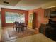 Charming dining area with wooden table and a view of kitchen at 1902 Abbington St # 1902, Apopka, FL 32712