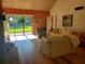 Bright living room with light beige couch and view of backyard at 1902 Abbington St # 1902, Apopka, FL 32712