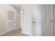 Hallway with a closet and neutral-toned carpet at 2191 Longleaf Rd, Davenport, FL 33837