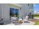 Relaxing patio with seating area and sliding glass doors at 2191 Longleaf Rd, Davenport, FL 33837