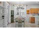 Bright dining area with a table and chairs near the kitchen at 2220 Cypress Trace Cir, Orlando, FL 32825