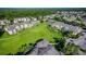 Aerial view of apartment community with green space and parking at 2302 Butterfly Palm Way # 102, Kissimmee, FL 34747