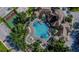 Community pool and surrounding amenities with basketball court at 2302 Butterfly Palm Way # 102, Kissimmee, FL 34747