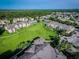 Aerial view of community, showing buildings and green spaces at 2302 Butterfly Palm Way # 102, Kissimmee, FL 34747