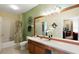 Clean bathroom with updated vanity, large mirror, and bathtub at 2302 Butterfly Palm Way # 102, Kissimmee, FL 34747