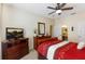Bright bedroom with a comfortable bed and plenty of storage at 2302 Butterfly Palm Way # 102, Kissimmee, FL 34747