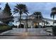 Gated entrance to community with guardhouse at 2302 Butterfly Palm Way # 102, Kissimmee, FL 34747