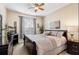 Main bedroom with a king-size bed and plenty of dresser space at 2302 Butterfly Palm Way # 102, Kissimmee, FL 34747
