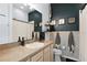 Bathroom with penny tile, and a modern vanity at 3350 Windleshore Way, Sanford, FL 32773