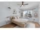 Bright bedroom with light wood furniture and boho accents at 3350 Windleshore Way, Sanford, FL 32773