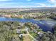 Wide aerial view of neighborhood and lake at 3644 Lake Shore Dr, Apopka, FL 32703