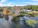 Aerial view of waterfront property and surrounding landscape at 3644 Lake Shore Dr, Apopka, FL 32703
