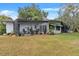 House with a screened patio and large backyard at 3644 Lake Shore Dr, Apopka, FL 32703
