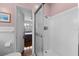 Bathroom with shower and view into bedroom at 3644 Lake Shore Dr, Apopka, FL 32703