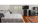 Spacious bedroom with hardwood floors, large bed, and ample closet space at 3644 Lake Shore Dr, Apopka, FL 32703