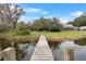 Wooden dock extending into lake leading to waterfront home at 3644 Lake Shore Dr, Apopka, FL 32703