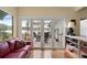 Relaxing Gathering room features hardwood floors, patio access, and peaceful water views at 3644 Lake Shore Dr, Apopka, FL 32703