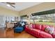 Bright Gathering room with hardwood floors, water views, and comfortable seating at 3644 Lake Shore Dr, Apopka, FL 32703