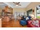 Open kitchen with island, hardwood floors, and views of the Gathering room at 3644 Lake Shore Dr, Apopka, FL 32703