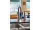 Stainless steel sink with modern brushed nickel faucet at 3644 Lake Shore Dr, Apopka, FL 32703
