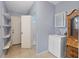 Laundry room with shelving, toilet and cabinet at 3644 Lake Shore Dr, Apopka, FL 32703