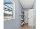 Laundry room with shelving and exterior access at 3644 Lake Shore Dr, Apopka, FL 32703