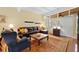 Bright living room featuring a leather sectional sofa and hardwood floors at 3644 Lake Shore Dr, Apopka, FL 32703