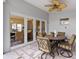 Outdoor patio with table and chairs, view of living room at 3644 Lake Shore Dr, Apopka, FL 32703