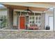 Covered porch with stone facade, ceiling fan, and bench at 3644 Lake Shore Dr, Apopka, FL 32703