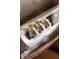 Close-up of a stainless steel gas range with metallic knobs at 3644 Lake Shore Dr, Apopka, FL 32703