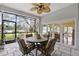 Screened patio overlooking a lake with table and chairs at 3644 Lake Shore Dr, Apopka, FL 32703