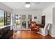 Relaxing sunroom with hardwood floors and access to patio at 3644 Lake Shore Dr, Apopka, FL 32703