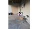 Covered back patio with storage and a chair at 4419 Lake Lawne Ave, Orlando, FL 32808