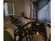 Small bedroom with a bed and wheelchair at 4419 Lake Lawne Ave, Orlando, FL 32808