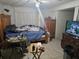 Main bedroom with double bed, dresser, and TV at 4419 Lake Lawne Ave, Orlando, FL 32808