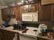 Kitchen with microwave, oven, and wooden cabinets at 4419 Lake Lawne Ave, Orlando, FL 32808