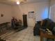 Living room with a couch, small table, and home gym equipment at 4419 Lake Lawne Ave, Orlando, FL 32808