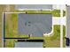 Aerial view of house shows the backyard, roof, and surrounding manicured lawn with landscaping at 4505 Hummingbird Ln, Haines City, FL 33844