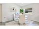 Bright dining room featuring a glass-top table and white chairs at 4505 Hummingbird Ln, Haines City, FL 33844