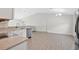 Well-lit kitchen featuring stainless steel appliances and granite countertops, opening to the dining area at 4505 Hummingbird Ln, Haines City, FL 33844